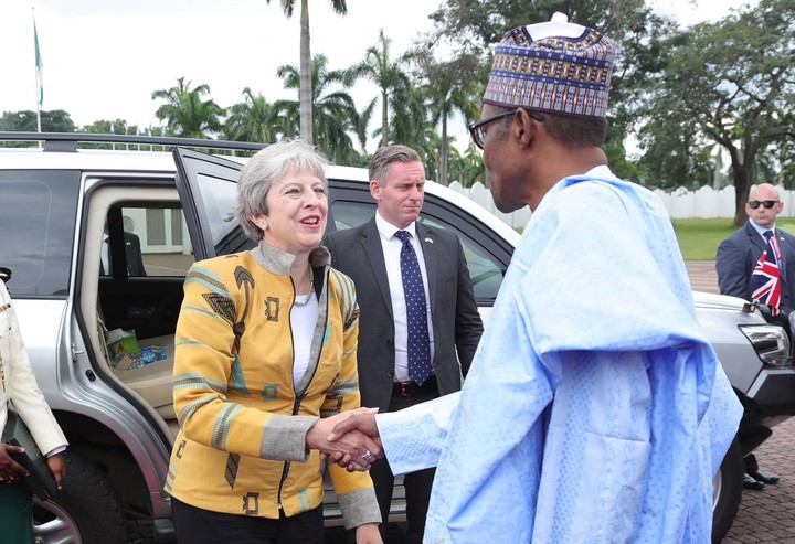 British Prime Minister Theresa May Looks Stunning Wearing Nigerian Designer Emmy Kasbit  